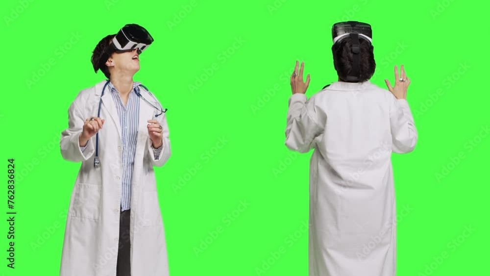 General practitioner works with virtual reality headset to examine checkup results for patients, using 3d artificial intelligence gadget. Medic uses interactive visual cyberspace. Camera B. General practitioner works with virtual reality headset to examine checkup results for patients, using 3d artificial intelligence gadget. Medic uses interactive visual cyberspace. Camera B.