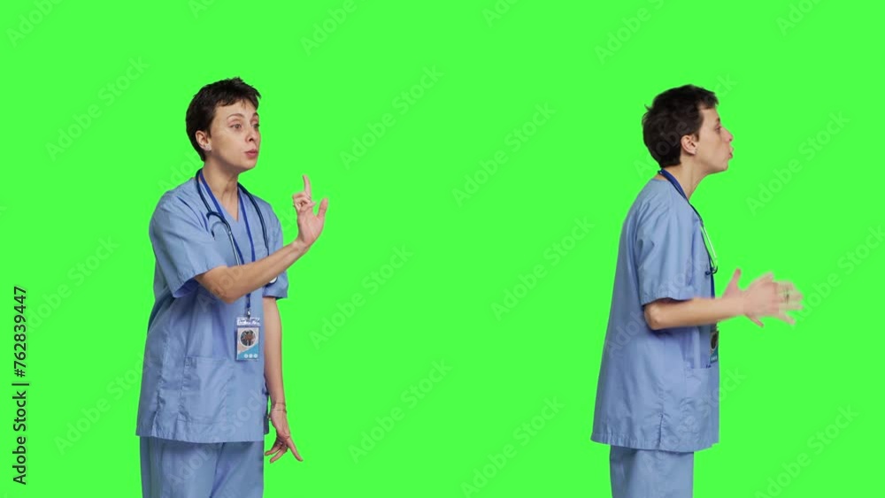Displeased irritated nurse shouting no and arguing with someone against greenscreen backdrop, showing rage and anger while she wears hospital scrubs. Aggressive medical assistant. Camera B. Displeased irritated nurse shouting no and arguing with someone against greenscreen backdrop, showing rage and anger while she wears hospital scrubs. Aggressive medical assistant. Camera B.