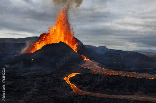 Volcanic eruption explosion and lava flow in the lava field of Fagradalsfjall, Geldingadalir,  Reykjanes Peninsula, Iceland