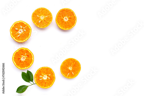 Vitamin C pills with  fresh orange citrus fruit isolated on white background.