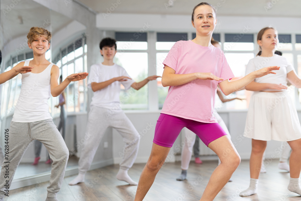 Group of children boys and girls dance jazz funk in studio