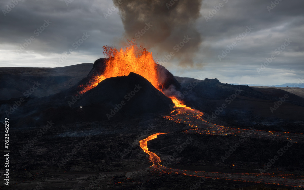 Volcanic eruption explosion and lava flow in the lava field of Fagradalsfjall, Geldingadalir,  Reykjanes Peninsula, Iceland