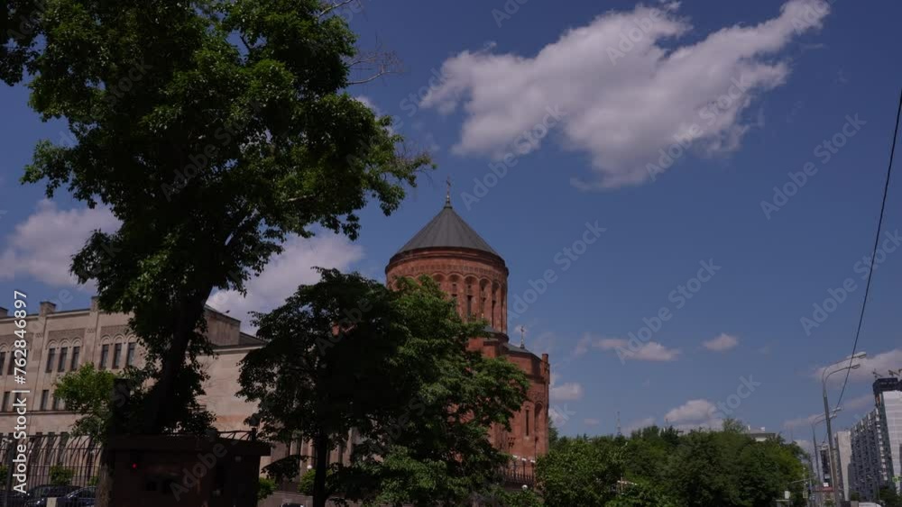 Video featuring various brick water towers surrounded by trees on a sunny day Video featuring various brick water towers surrounded by trees on a sunny day