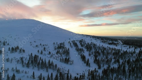 Aerial view around the slopes of Yllastunturi, winter dusk in Yllas, Lapland photo