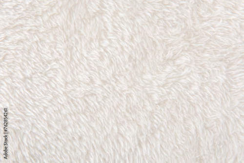 white plush fabric texture background, background pattern of soft warm material © zhikun sun