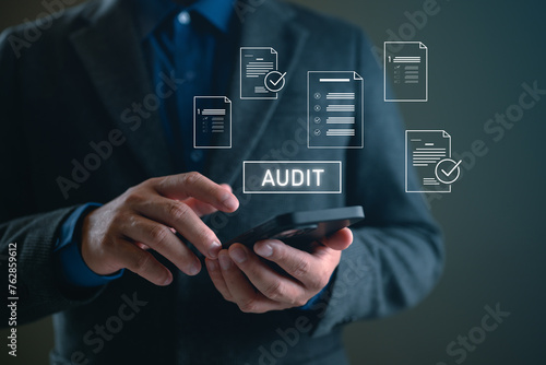 Businessman Audit online documents, quality assessment management With a checklist, business document evaluation process, market data report analysis and consulting, plan review process.