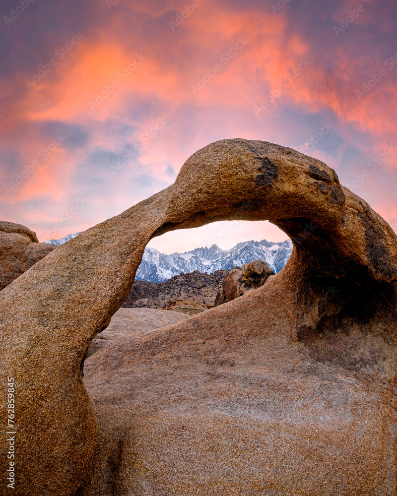 Sunset at Mobius Arch with snowy mountains on the background,, Alabama Hills, California Sunset at Mobius Arch with snowy mountains on the background,, Alabama Hills, California