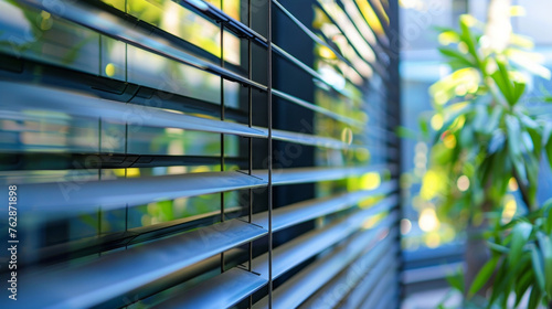 A closeup of smart glass louvres an innovative feature allowing for dynamic shading and ventilation control lending a modern and sustainable touch to the buildings exterior. photo