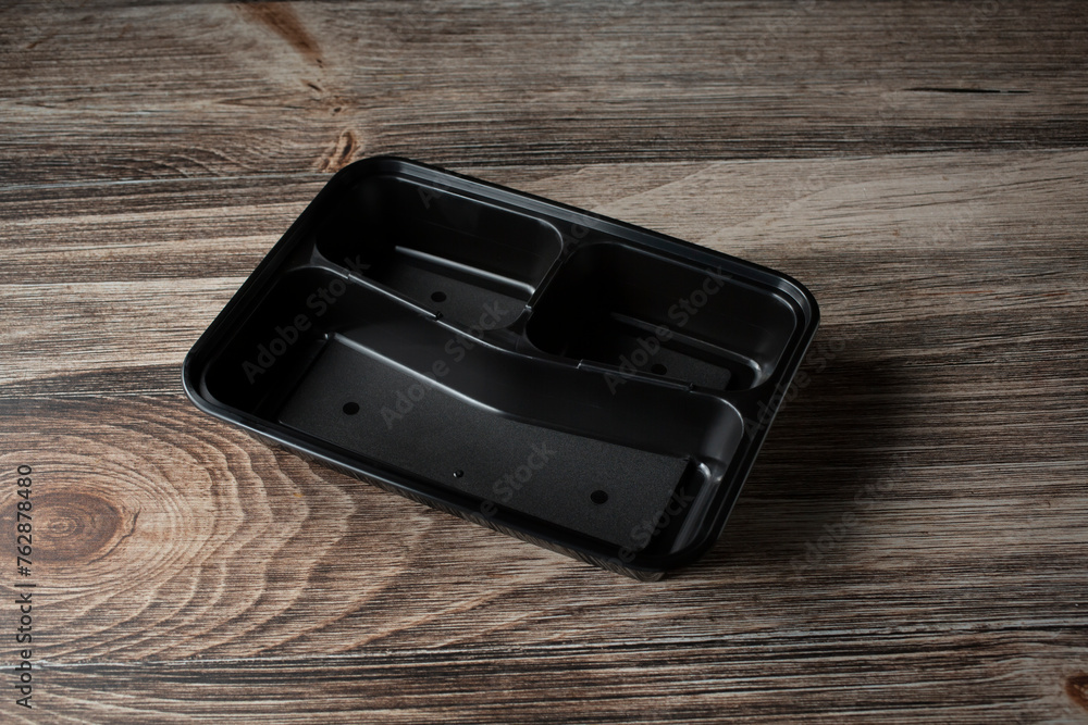 A view of a black plastic compartment food tray. A view of a black plastic compartment food tray.