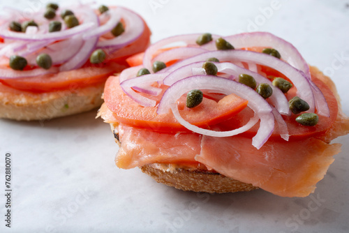 A view of an open faced lox bagel. photo