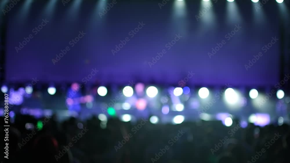 Blur shadow and light,Happy people dance in nightclub party concert and listen to music from DJ on the stage in background. Music performance concert on stage Blur shadow and light,Happy people dance in nightclub party concert and listen to music from DJ on the stage in background. Music performance concert on stage