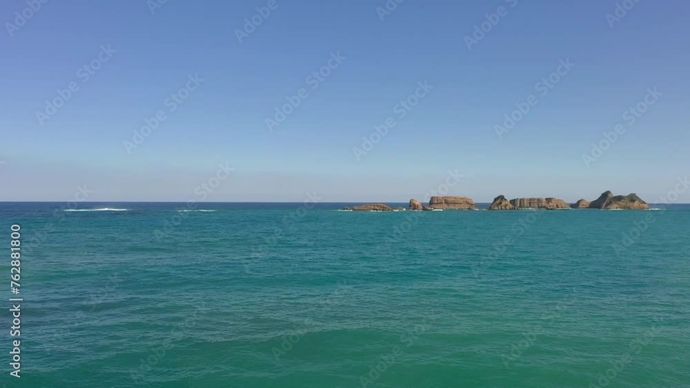 Drone heading for rocks above the sea.
Blue sky and beautiful ocean. Drone heading for rocks above the sea.
Blue sky and beautiful ocean.