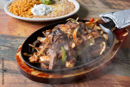 A view of a sizzling order of fajitas.