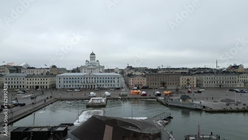 Aerial slide and pan shot of tower of famous Helsinki Cathedral. Major tourist landmark in city. Helsinki, Finland photo