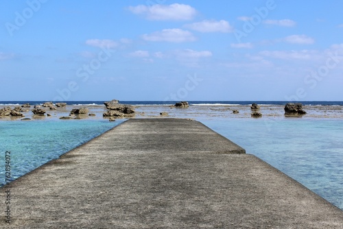 A panoramic view from the concrete pier on transparent blue sea water  © octobersun
