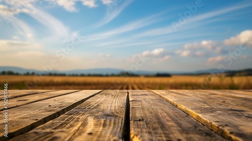 The empty wooden brown table top with blur background of farmland and blue sky Exuberant image : Generative AI photo