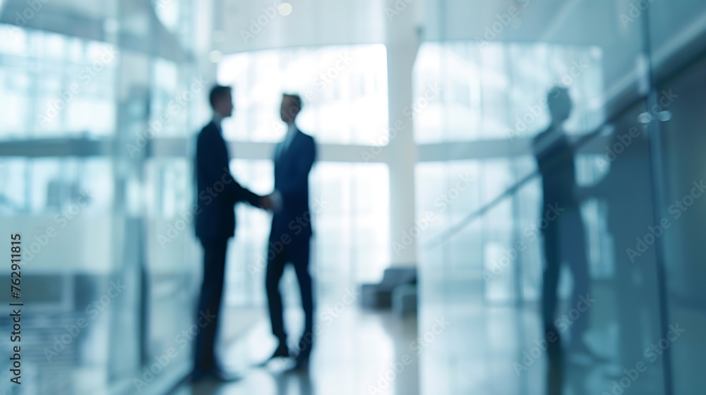 Building business relationships Blurred shot of two businessmen shaking hands in a modern office : Generative AI