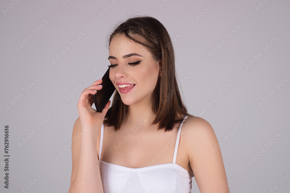 Young woman with mobile phone or smartphone. Young woman with mobile phone or smartphone.