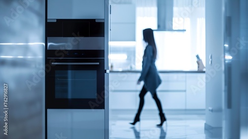 Blurred silhouette of young woman walking at home Panoramic view of modern interior with white kitchen cupboards wooden countertop electric oven : Generative AI