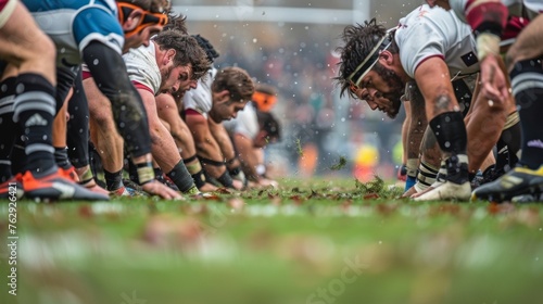 The focus and strength of players legs as they drive forward in the scrum.