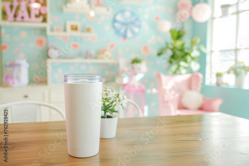 Insulated Tumbler on Wooden Surface with Whimsical Pastel Room Decor