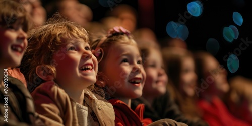 Group of Children Watching Live Theater Performance, Excited Kids on Educational Field Trip, Happy Boys and Girls Engaged in Cultural Experience, Young Audience at Playhouse photo