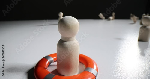 Pawn with lifebuoy stays safe vulnerable figures blew away photo