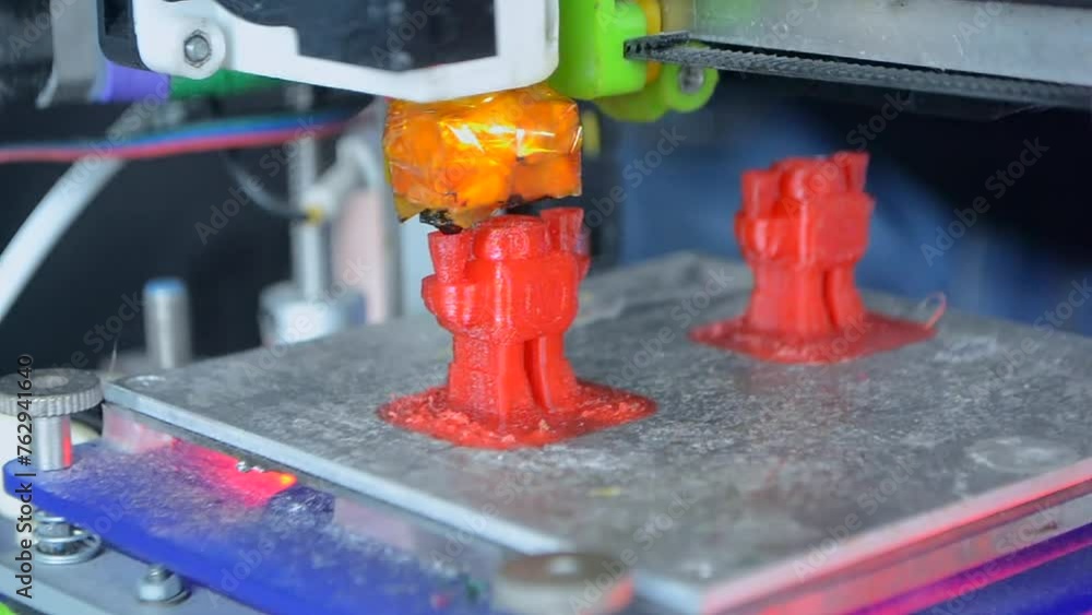 3D printer prints an object. The process of printing model on 3D printer. Model printed on 3D printer from molten plastic. 3D printing technologies. Additive progressive new modern printing technology 3D printer prints an object. The process of printing model on 3D printer. Model printed on 3D printer from molten plastic. 3D printing technologies. Additive progressive new modern printing technology