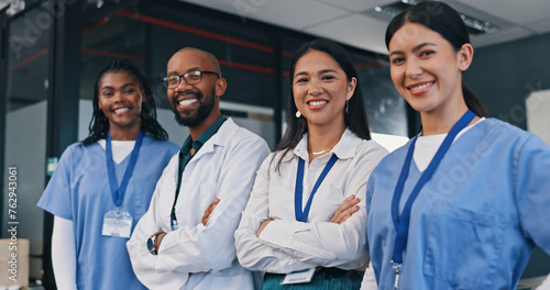 Doctors, group and happy with arms crossed in hospital with confidence in medical goals or mission. Healthcare, team and portrait of people in clinic working in medicare with pride and diversity