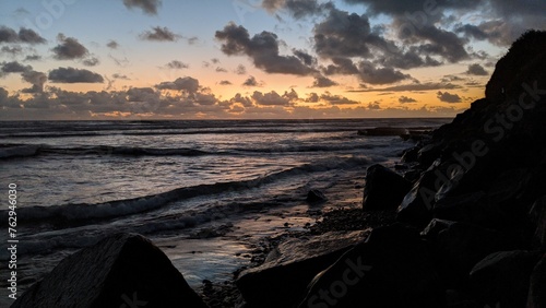 Southern California beach scenes with sunsets, surfers, tide pools and palms trees at Swamis Reef Surf Park and Moonlight Beach in Encinitas California.