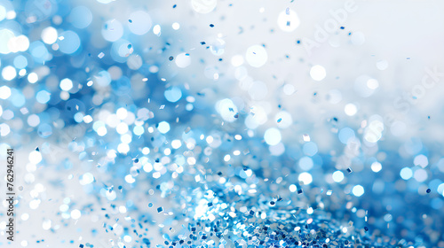 A blue and white background with a lot of blue and white specks. The blue specks are scattered all over the background, creating a sense of movement and energy