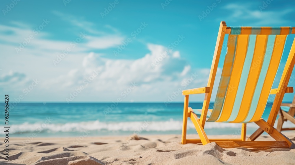 A beach chair is sitting on the sand next to the ocean