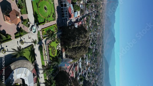 Vertical drone dolley view of a tule tree in Oaxaca in Mexico on a sunny day. photo