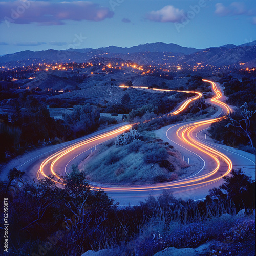 Light trails on mountain road at night