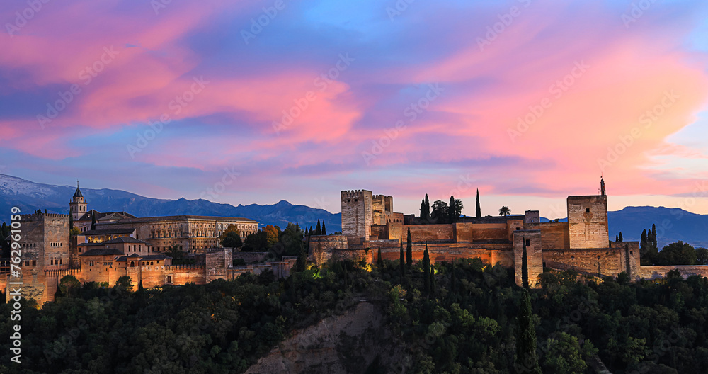 The landscape  view with Alhambra of Granada, Spain. Alhambra fortress and Albaicin quarter at twilight sky scene