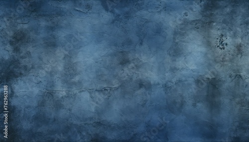 A dark blue background with a rough texture, suitable for adding text or images. © Goojournoon