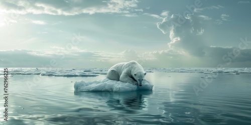 A polar bear is laying on a piece of ice in the ocean