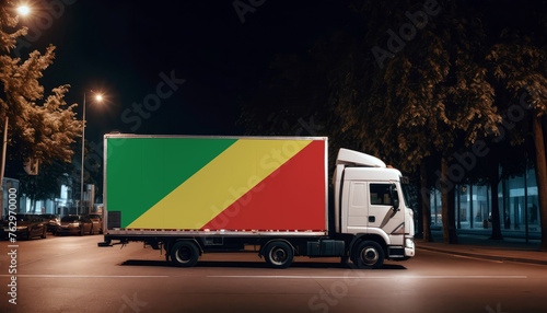 Republic of the Congo  flag on the back of white truck against the backdrop of the city. Truck  transport  freight transport. Freight and Logistics Concept