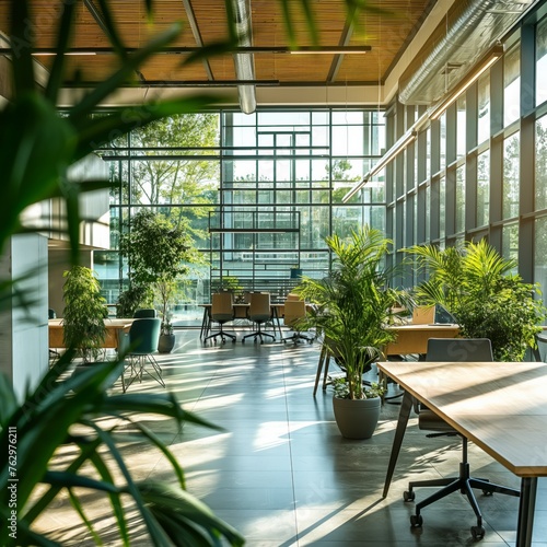 Sunny modern office space filled with greenery. This bright office interior boasts natural light, green plants, and a seamless blend of indoor and outdoor elements photo