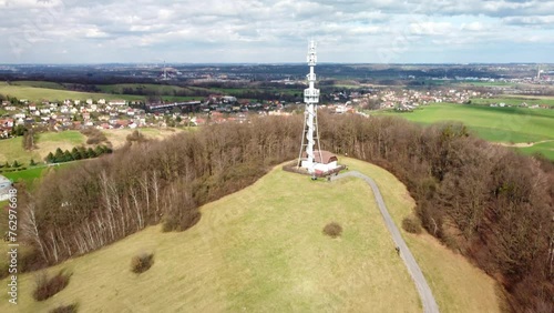 Rozhledna Okrouhla On Okrouhla Hill With Staric Village In The Background In Czech Republic. - aerial pullback photo