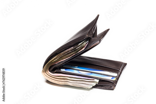 Picture concept with finance and banking. Brown leather wallet with money isolated on white background