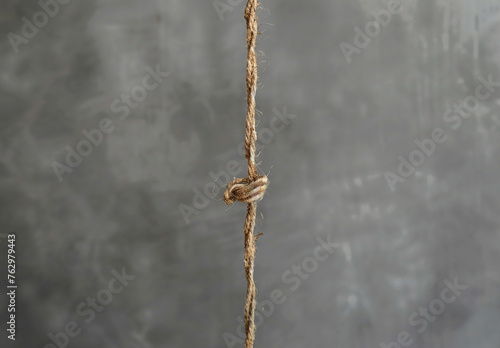 Natural fiber knot. Nautical knots. Gray background.