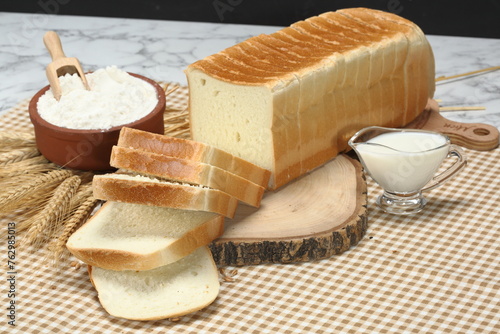 sliced square toast bread on wood