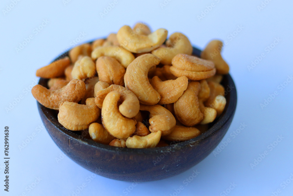cashews are displayed in traditional and glass containers cashews are displayed in traditional and glass containers