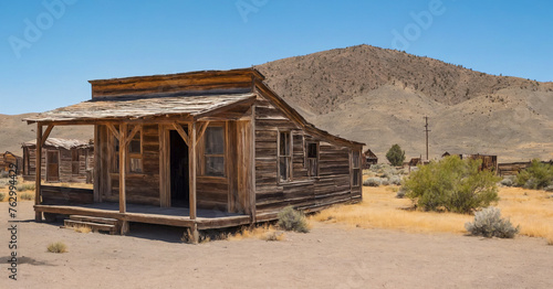 Old wooden shack stands weathered and abandoned in the wild west, relic of nevada's mining history and haunting reminder of the past.
