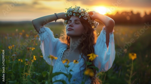 Slavic rituals on Kupala night. Lighting a bonfire, divination, weaving wreaths. A young woman photo