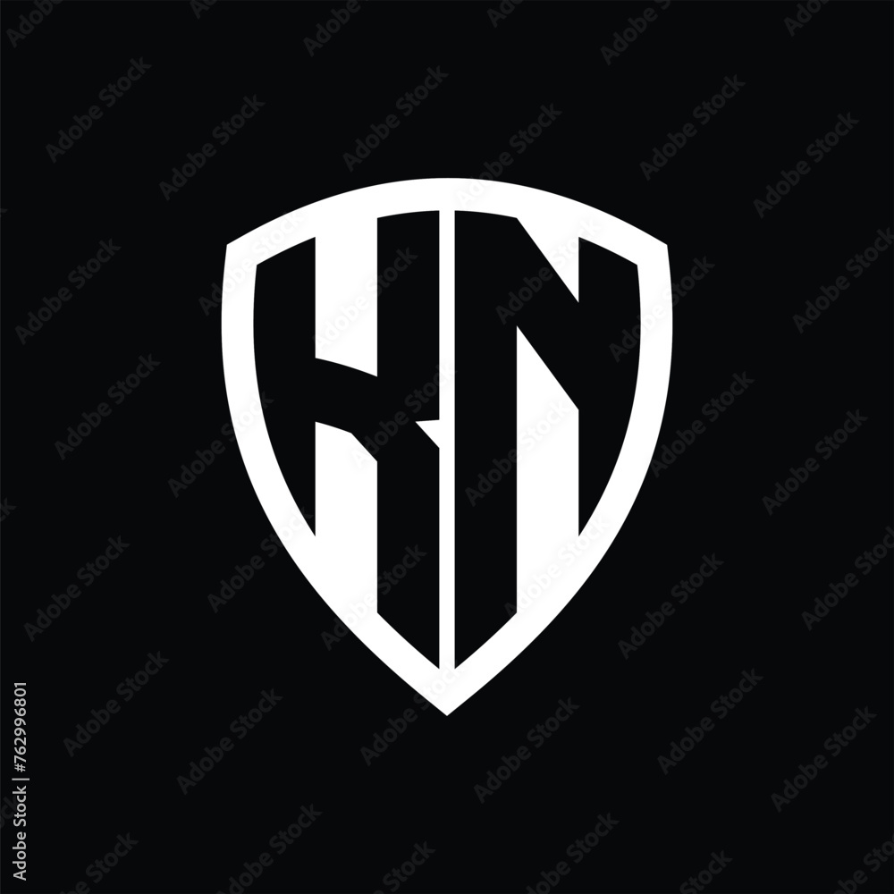 KN monogram logo with bold letters shield shape with black and white color design KN monogram logo with bold letters shield shape with black and white color design