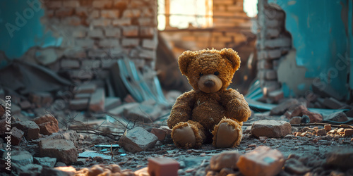 Old teddy bear in ruins of house photo