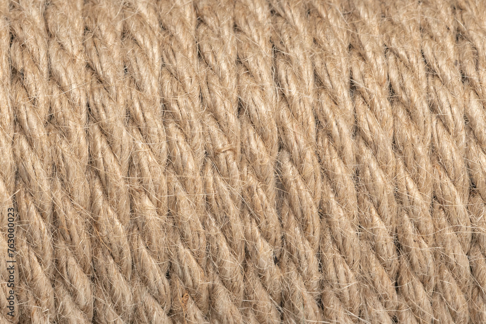 Fototapeta premium Jute ropes closeup, background texture. thick hemp rope. linen rope-wound. Hank ship rope