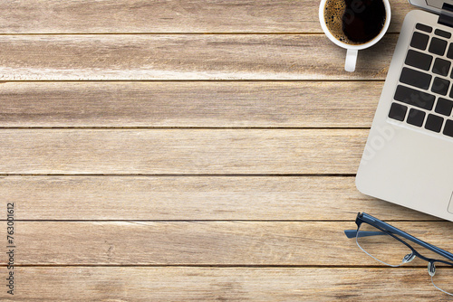 Cup of coffee on a office desk or wood table background.